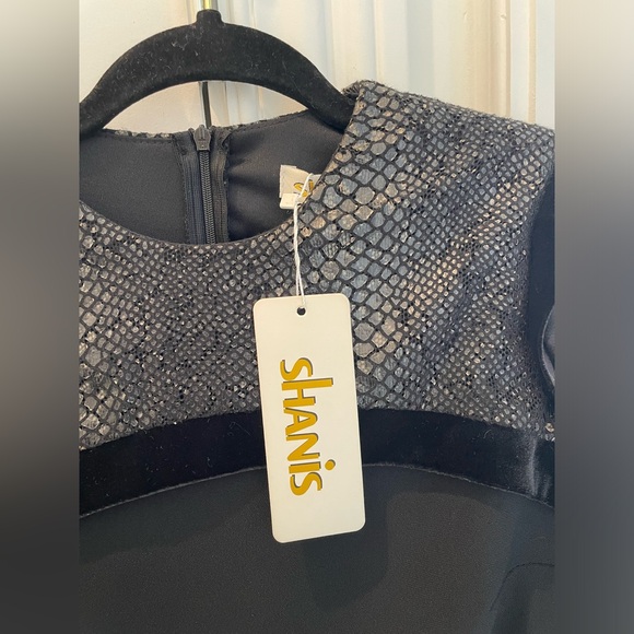 Shanis black long sleeve knee length dress. Poof detail at cuff. - Picture 5 of 6